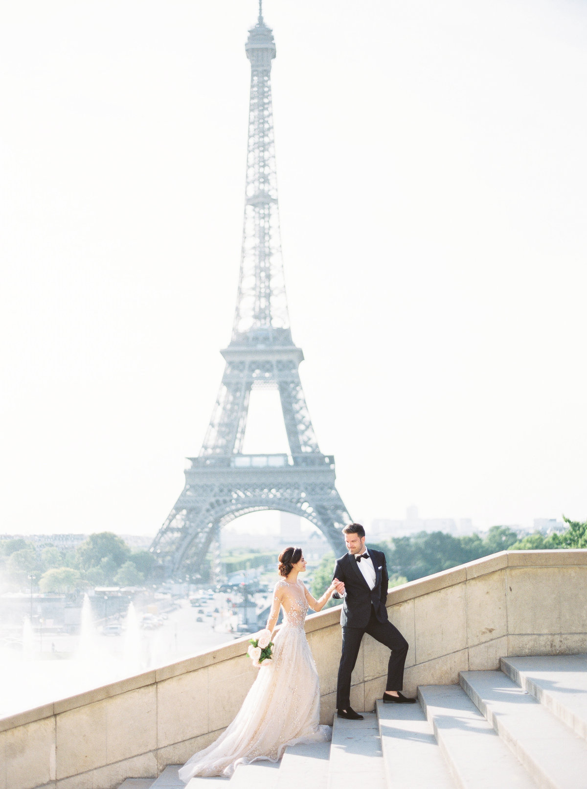 Bride and groom at the Eiffel Tower in Paris, France