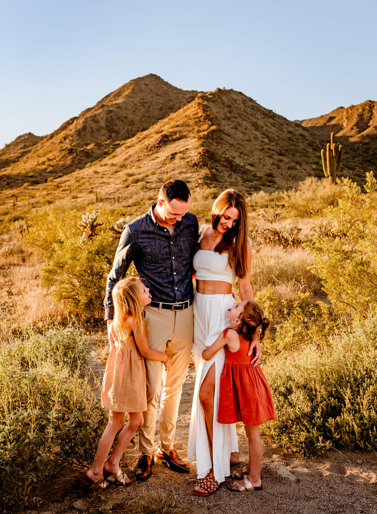 Arizona family standing and posing for family portraits by Cactus & Pine Photography LLC