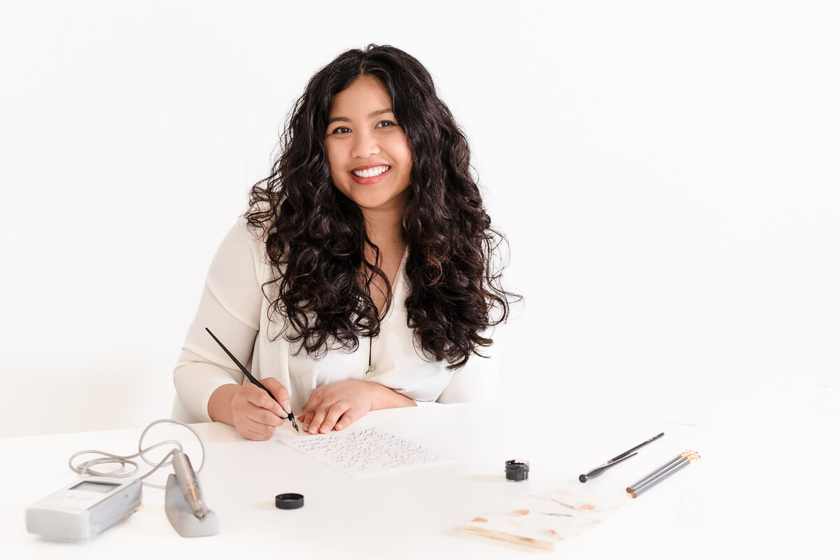 headshot of a calligrapher with her tools