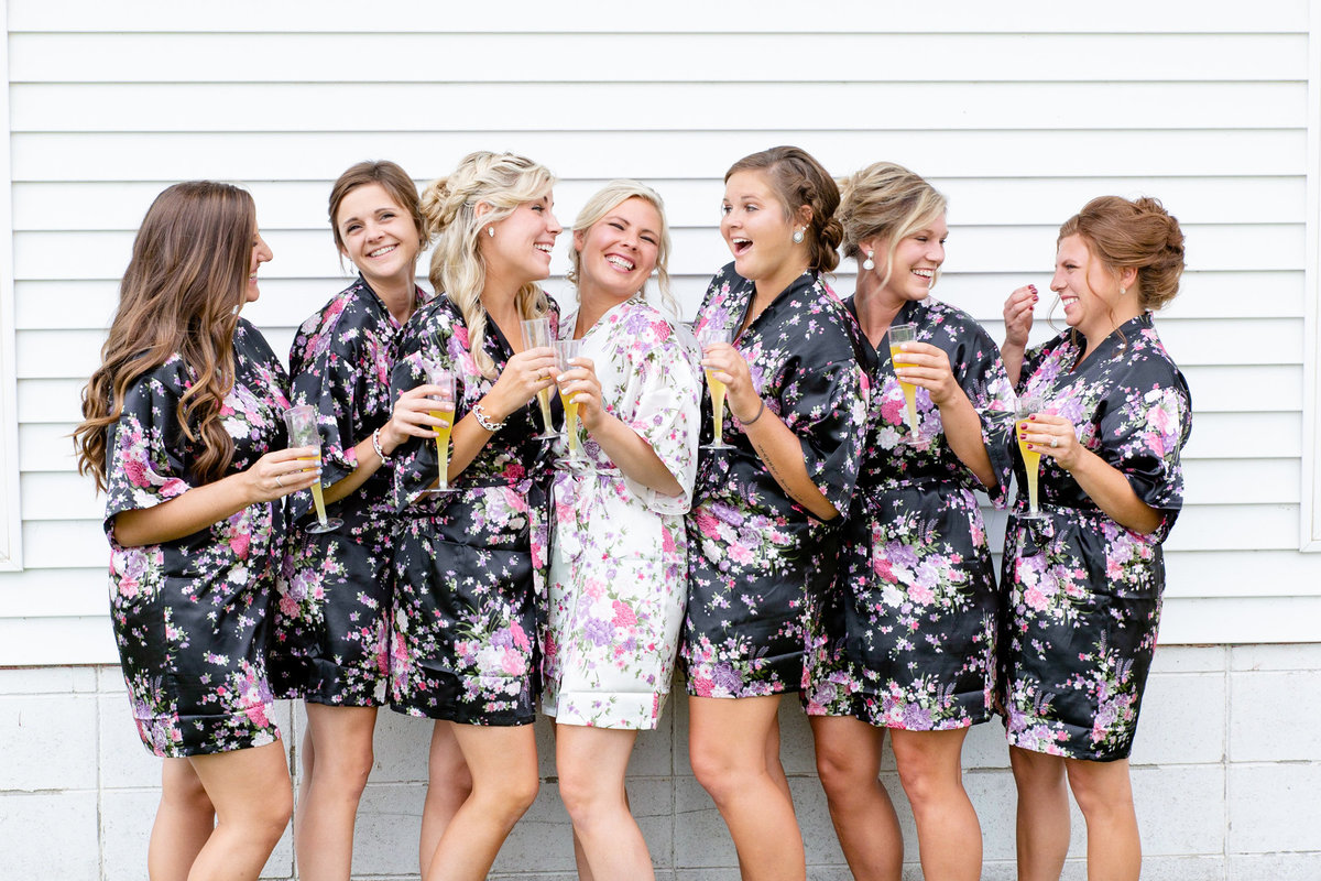 Bride and her bridesmaids celebrate upcoming wedding with a fun-filled toast