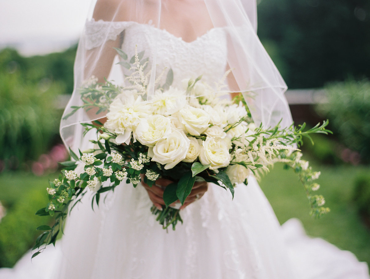 Bride with large white bridal bouquet
