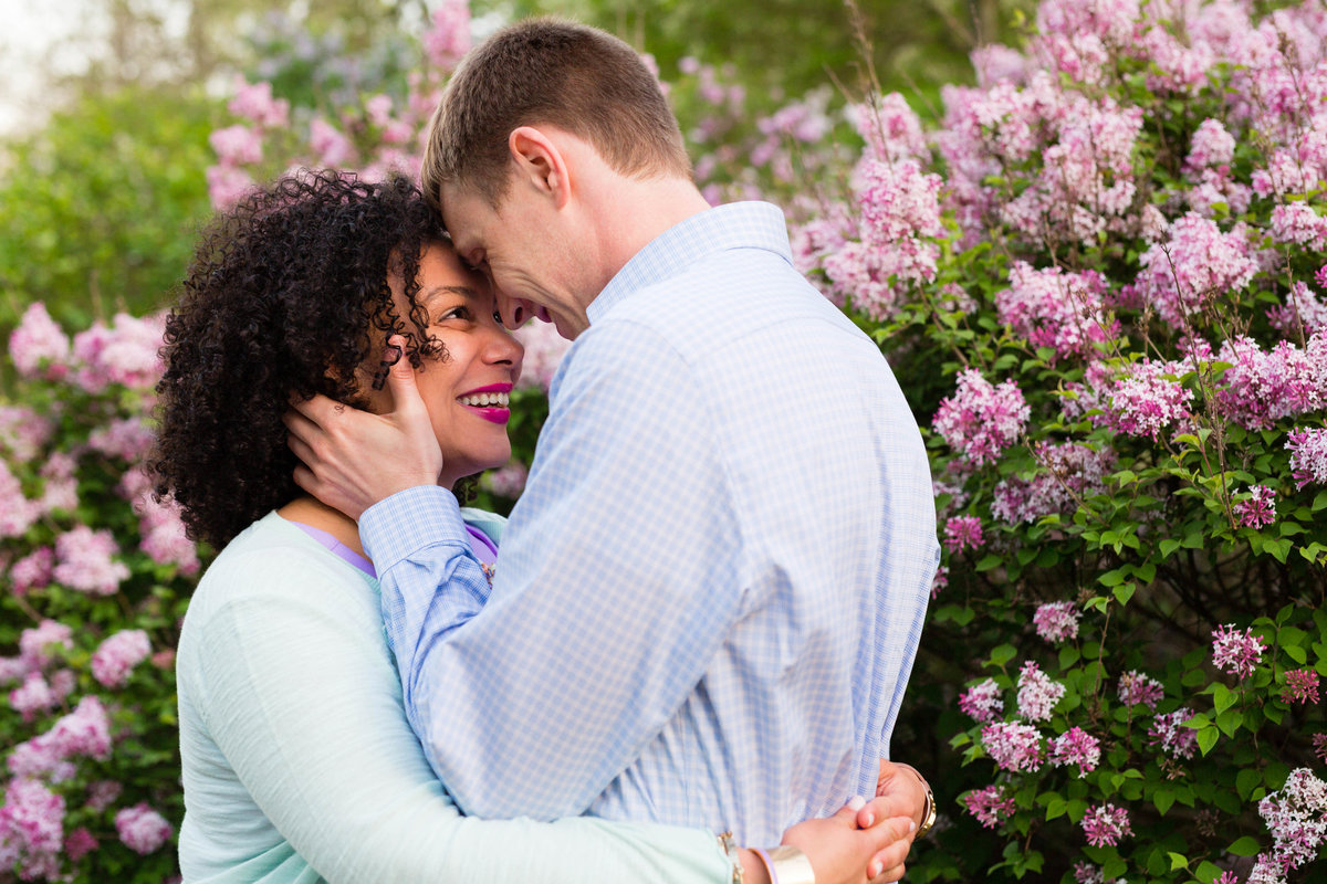 Arnold Arboretum in MA is the backdrop of this laughing couple at their engagement session