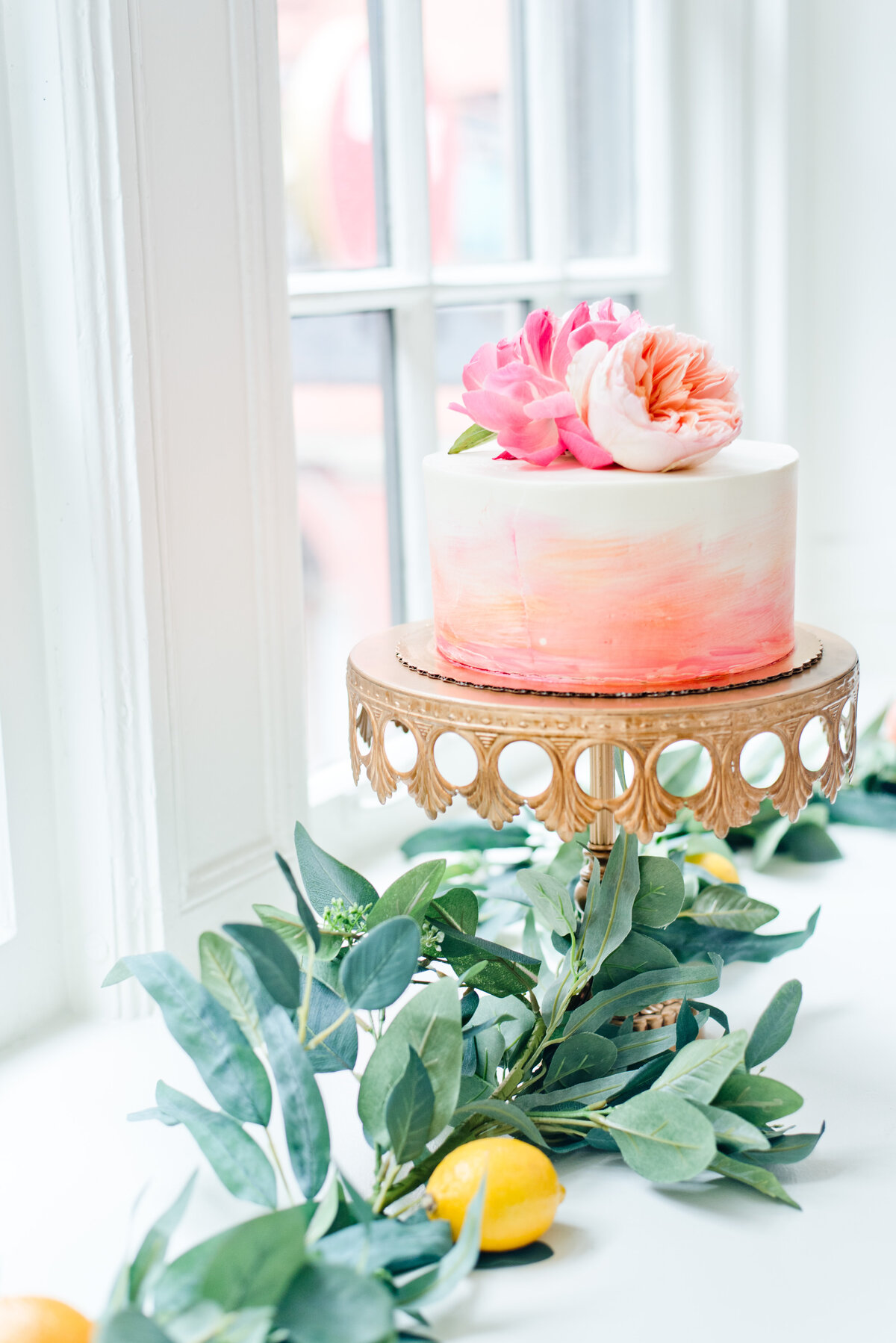 Greenery and colorful cake at Fort Worth wedding reception