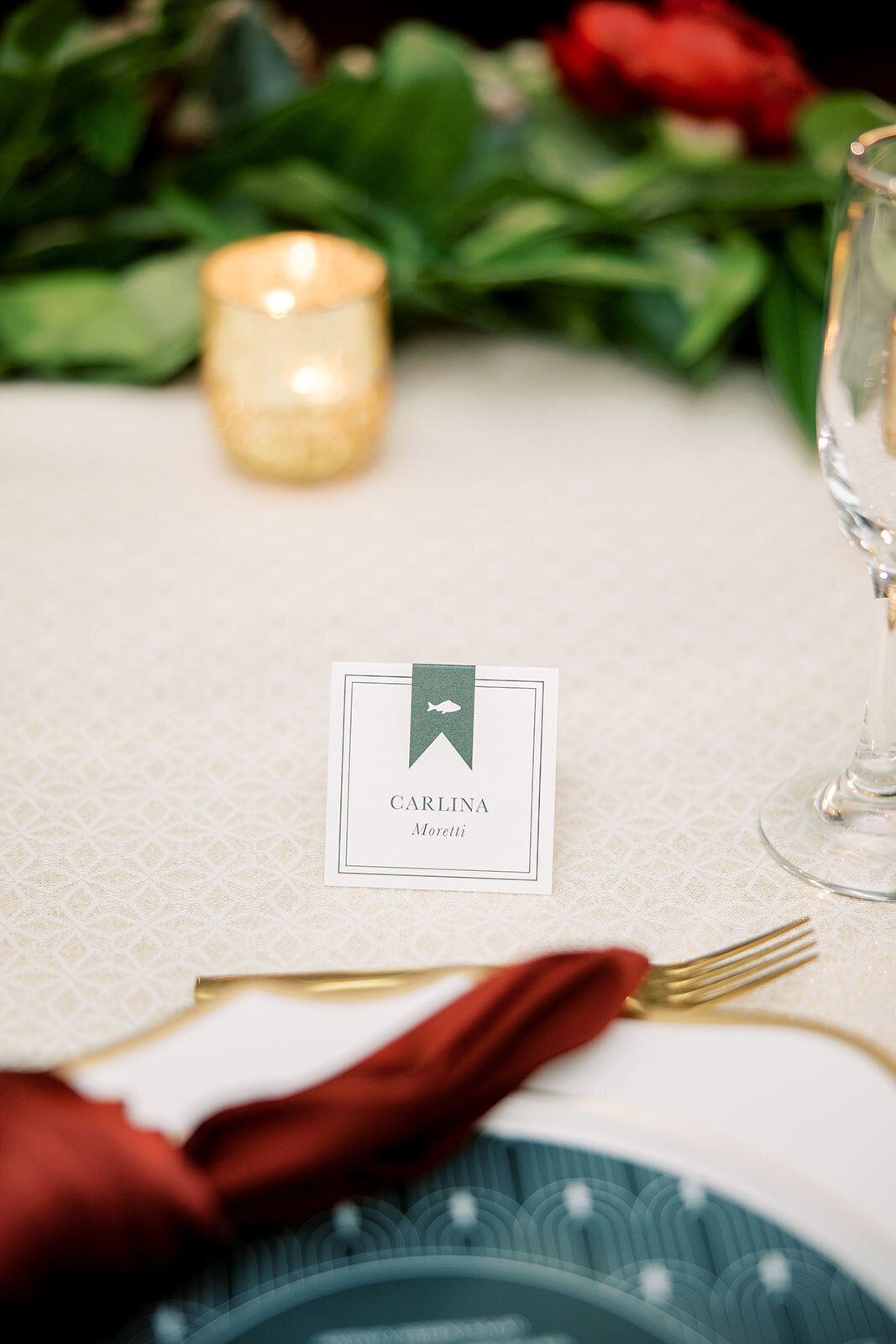Stylish square tented place cards displaying guest names and menu choices for a December wedding at the Don Cesar Hotel, St. Pete Beach, FL.