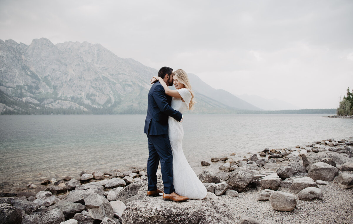 Photographers Jackson Hole capture bride and groom embracing