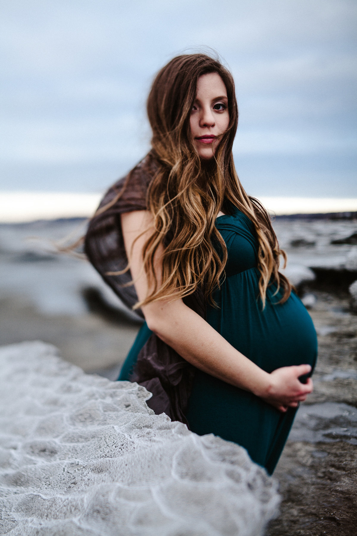 pregnant woman surrounded by ocean ice