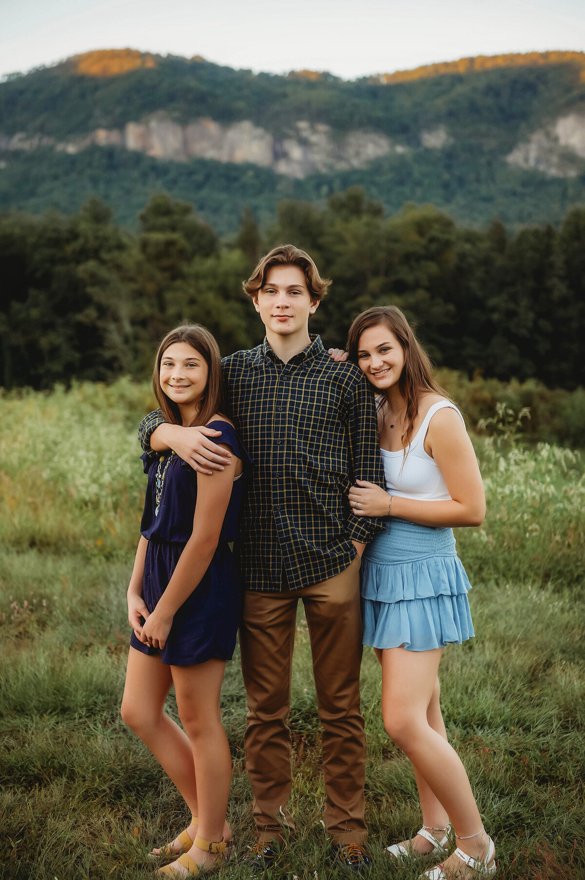 Siblings post for portraits during Family Photos in Lake Lure, NC.