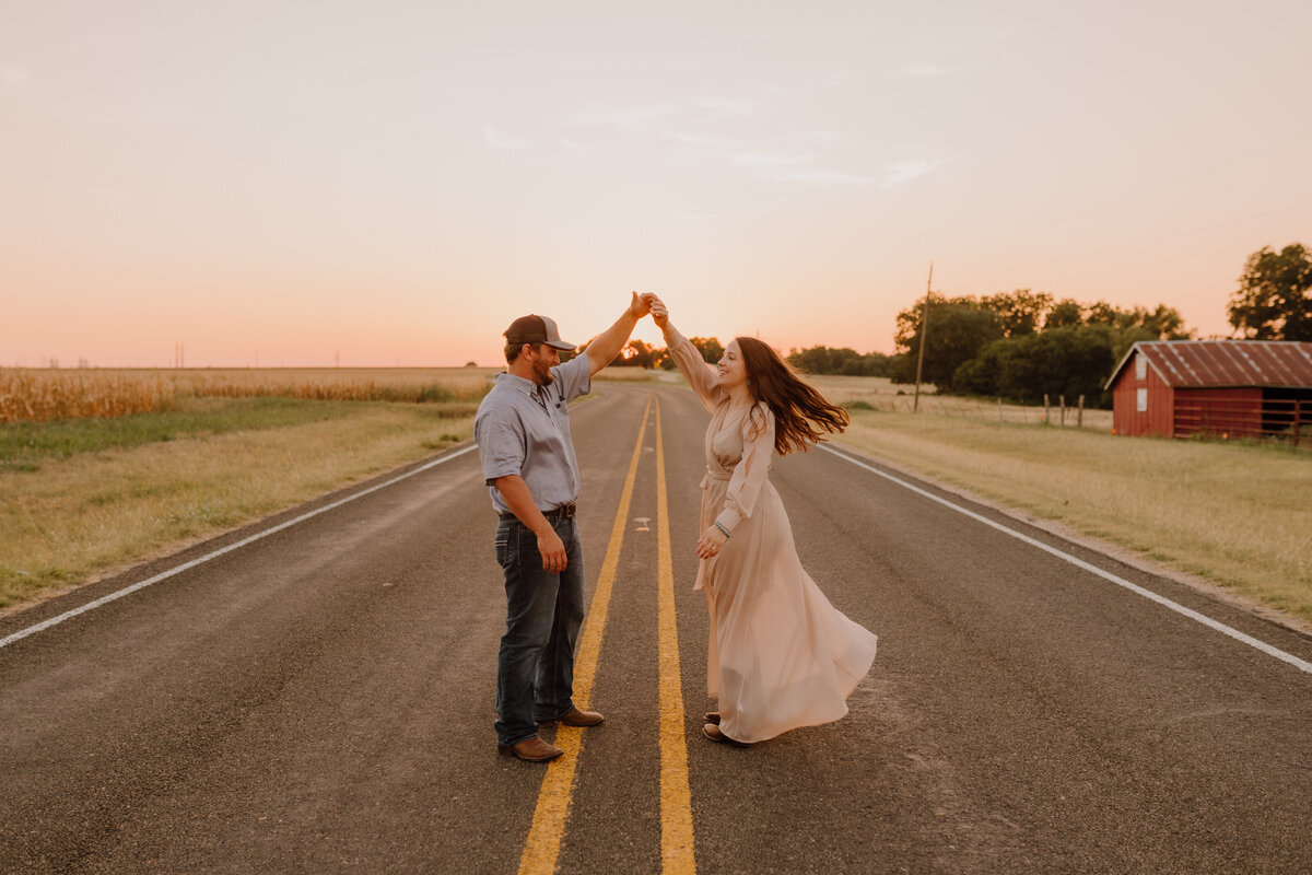 couple dancing in road