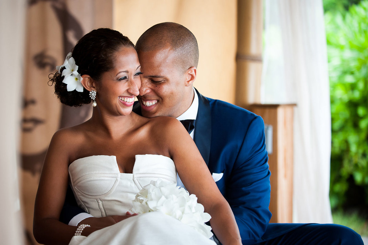 Harbour Island Bahamasnewlyweds smiling as groom holds bride