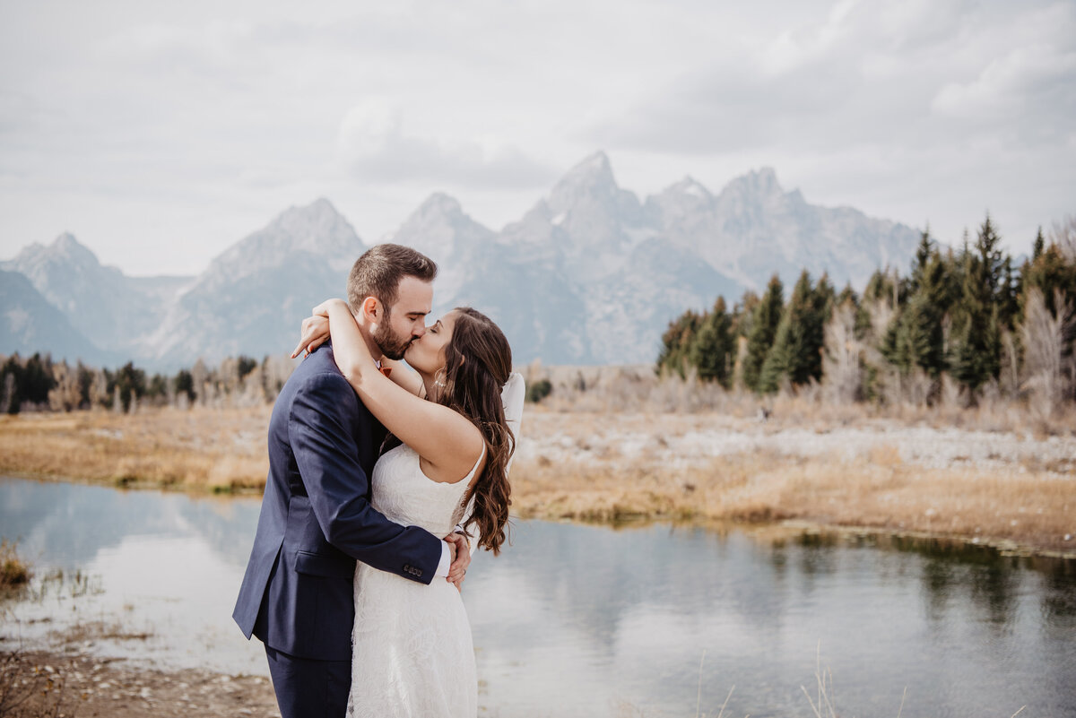 Photographers Jackson Hole capture couple kissing after Grand Teton elopement