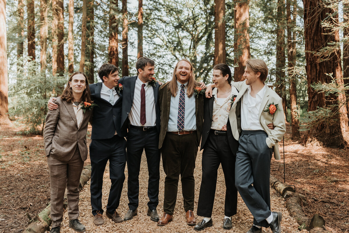 Groom chatting to his Groomsmen in the Redwoods at his relaxed forest wedding at Two Woods Estate