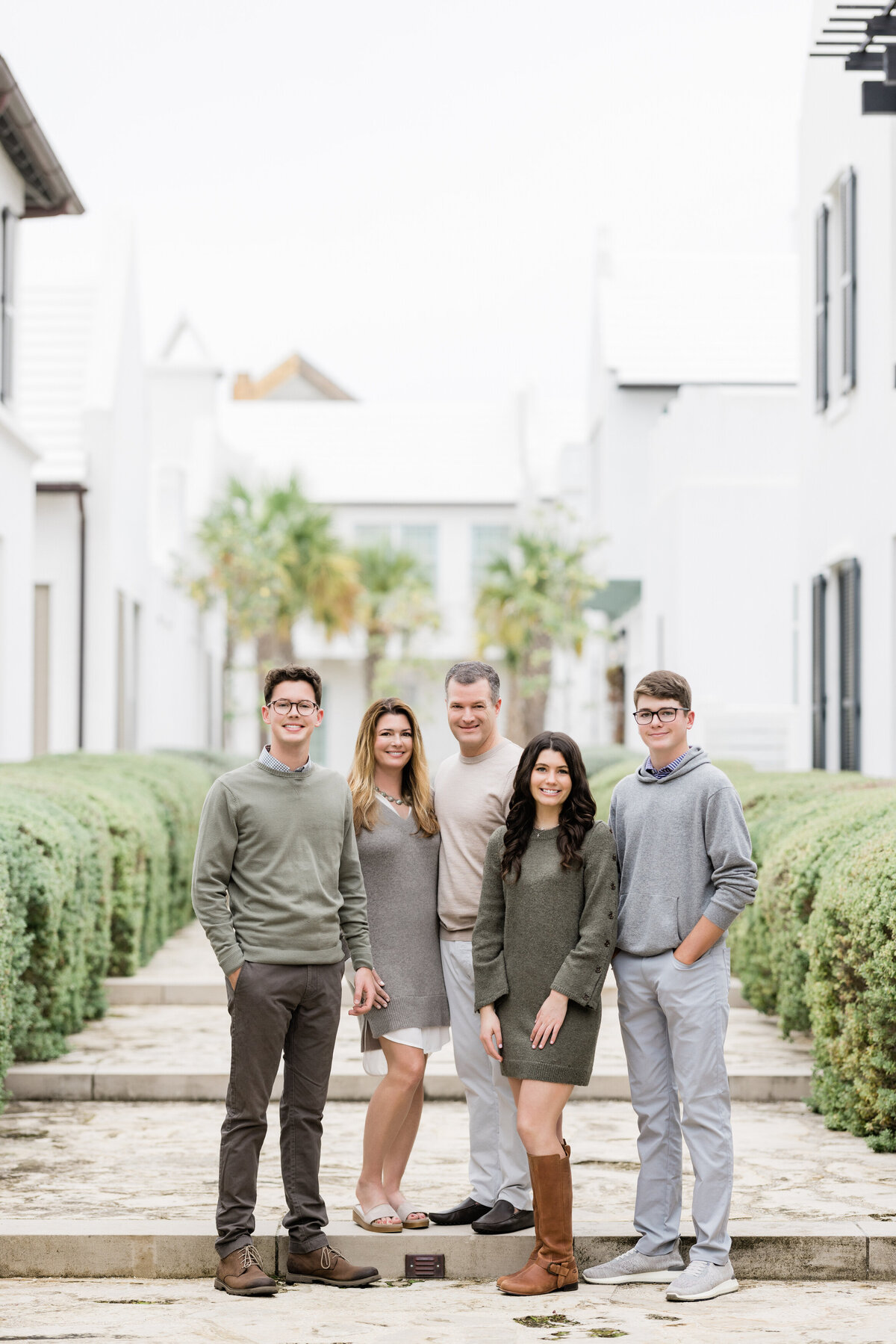 A small family standing together smiling