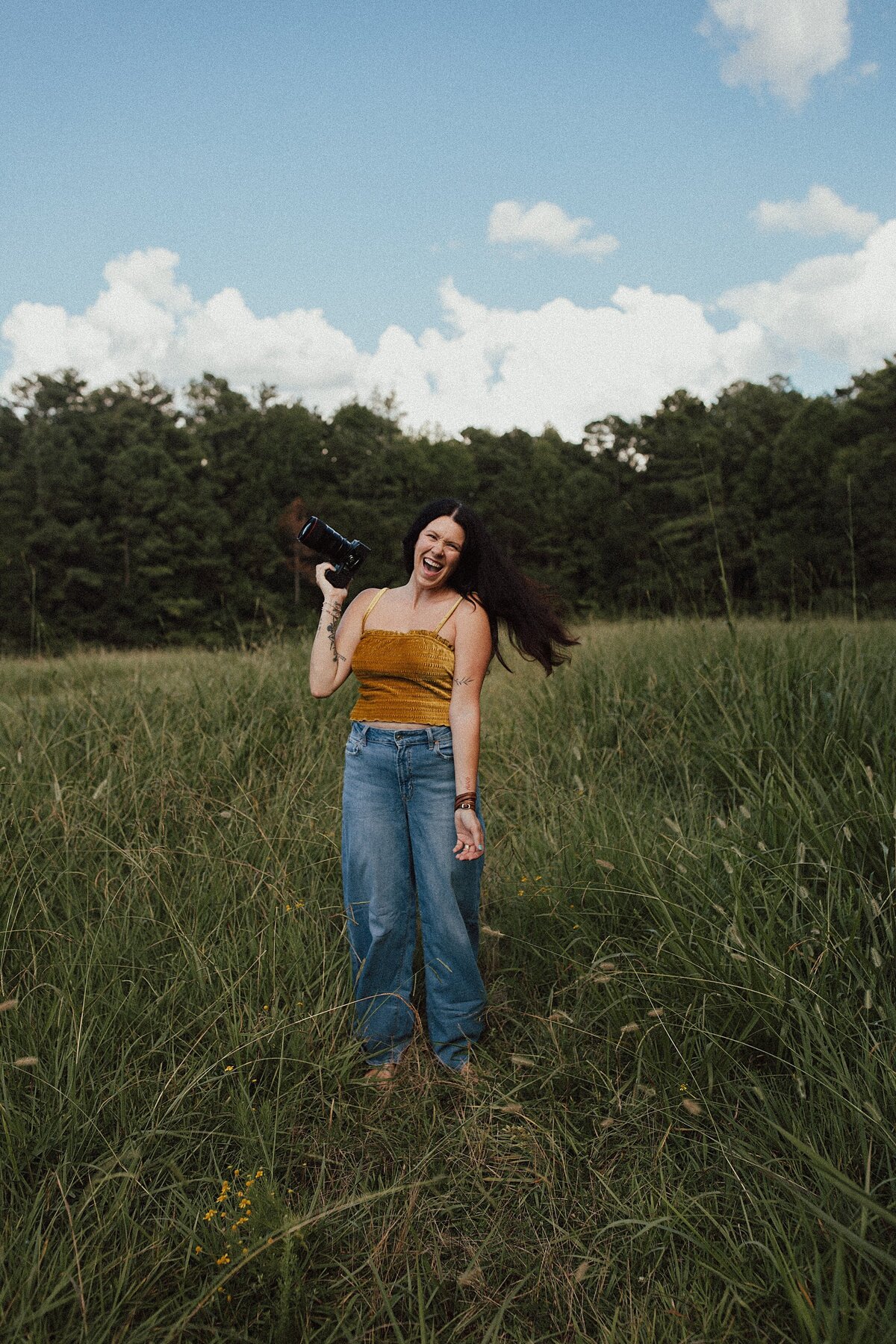 Family and Maternity Photographer, alyssa hollis standing in the field for photos