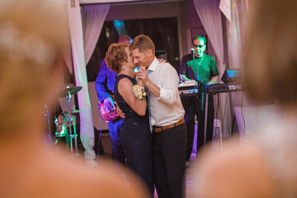 Mother of the groom and groom dancing