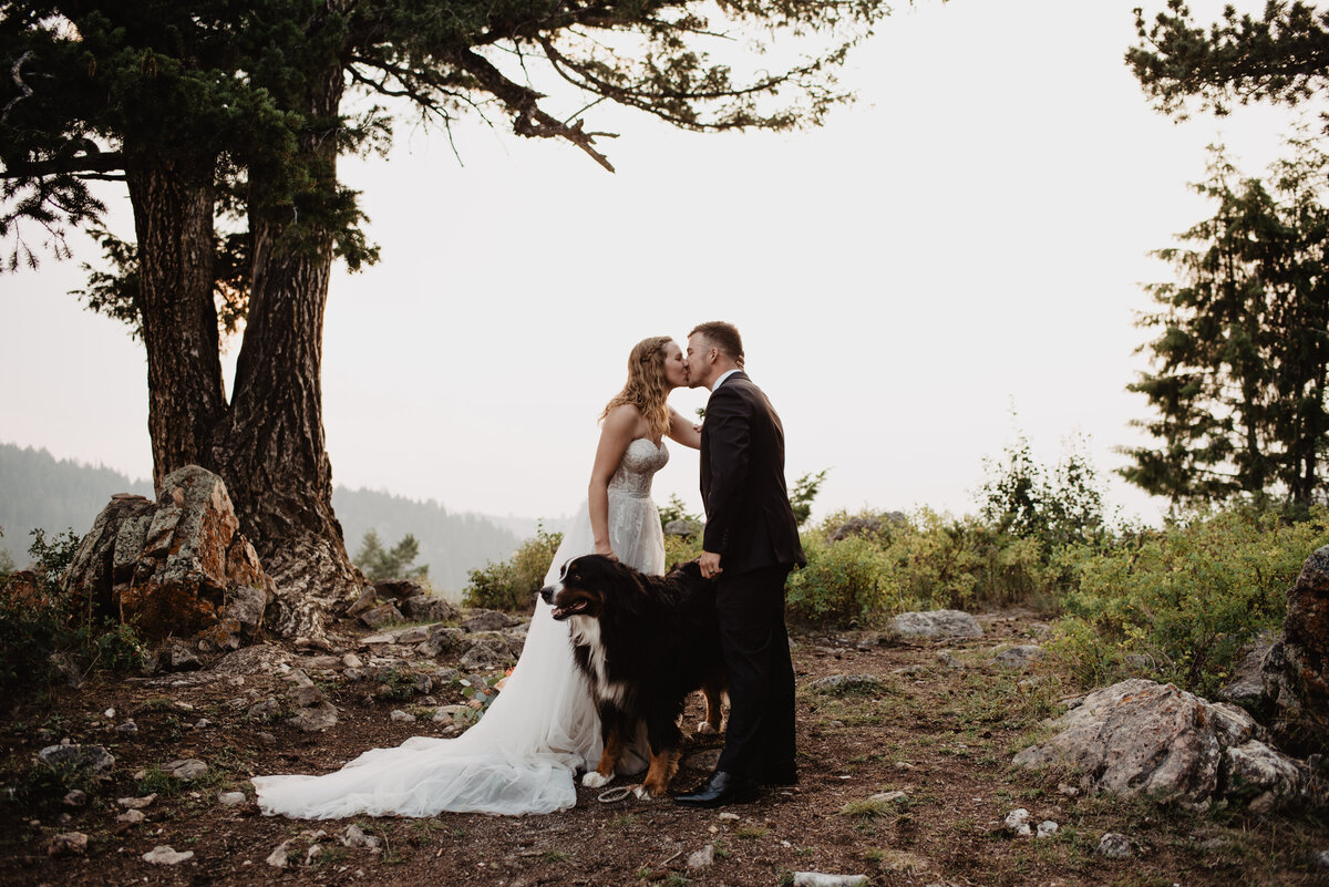 Jackson Hole Photographers capture man and woman kissing as newly married couple
