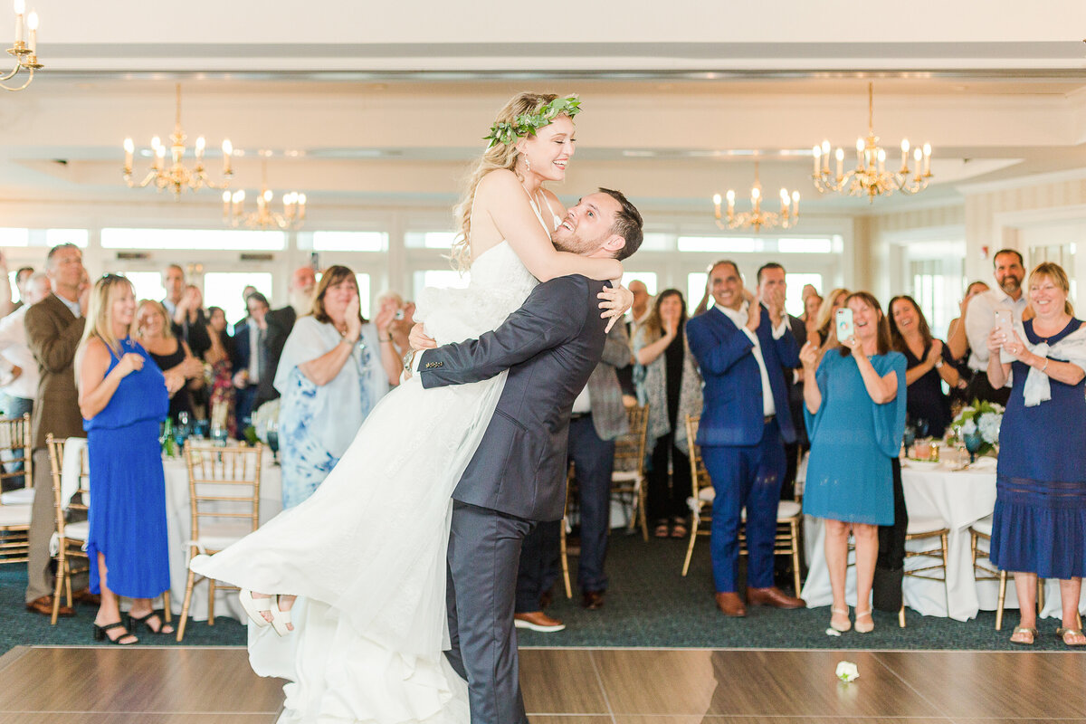 Bride and groom share their first dance at their Madison Beach Hotel wedding reception. Captured by best New England wedding photographer Lia Rose Weddings.
