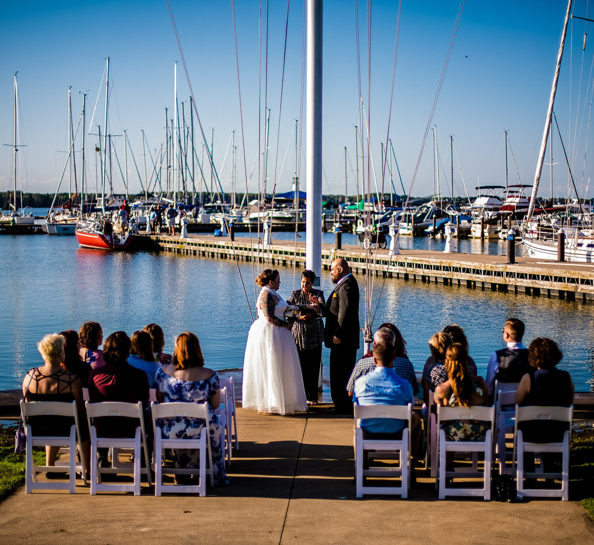 Wedding ceremony held by the flagpole at the Erie Yacht Club