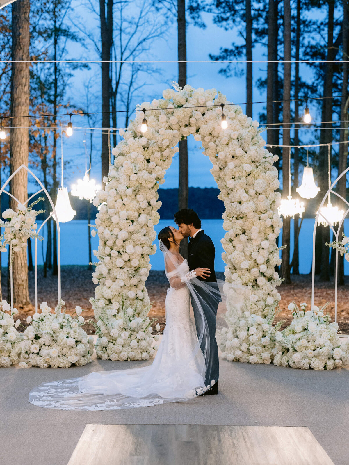 Golden hour wedding photos outside ceremony with chandeliers