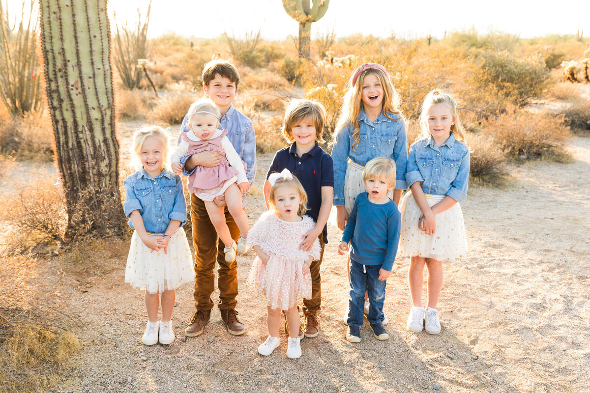 family smiling together in Scottsdale desert