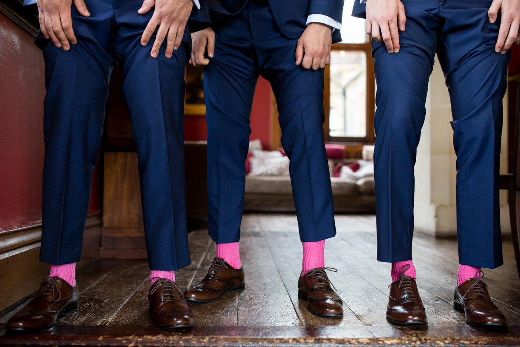 Ushers showing their pink socks at Huntsham Court Wedding Devon