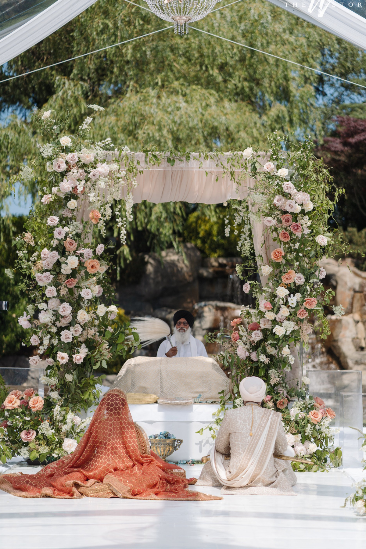sikh-wedding-outdoor-peach-roses-greenery-palki-mandap-bride-groom