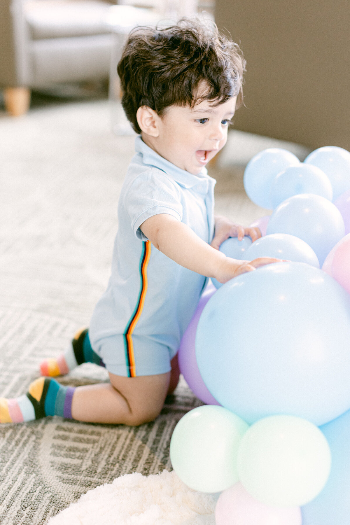 Young Boy Playing with Balloons