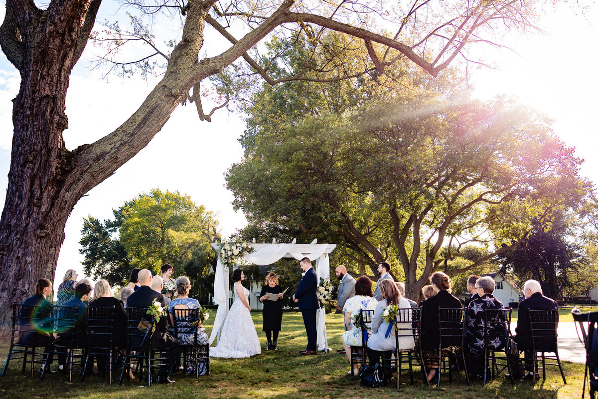 One of the top wedding photos of 2021. Taken by Adore Wedding Photography- Toledo, Ohio Wedding Photographers. This photo is of a wedding ceremony at the McIntyre