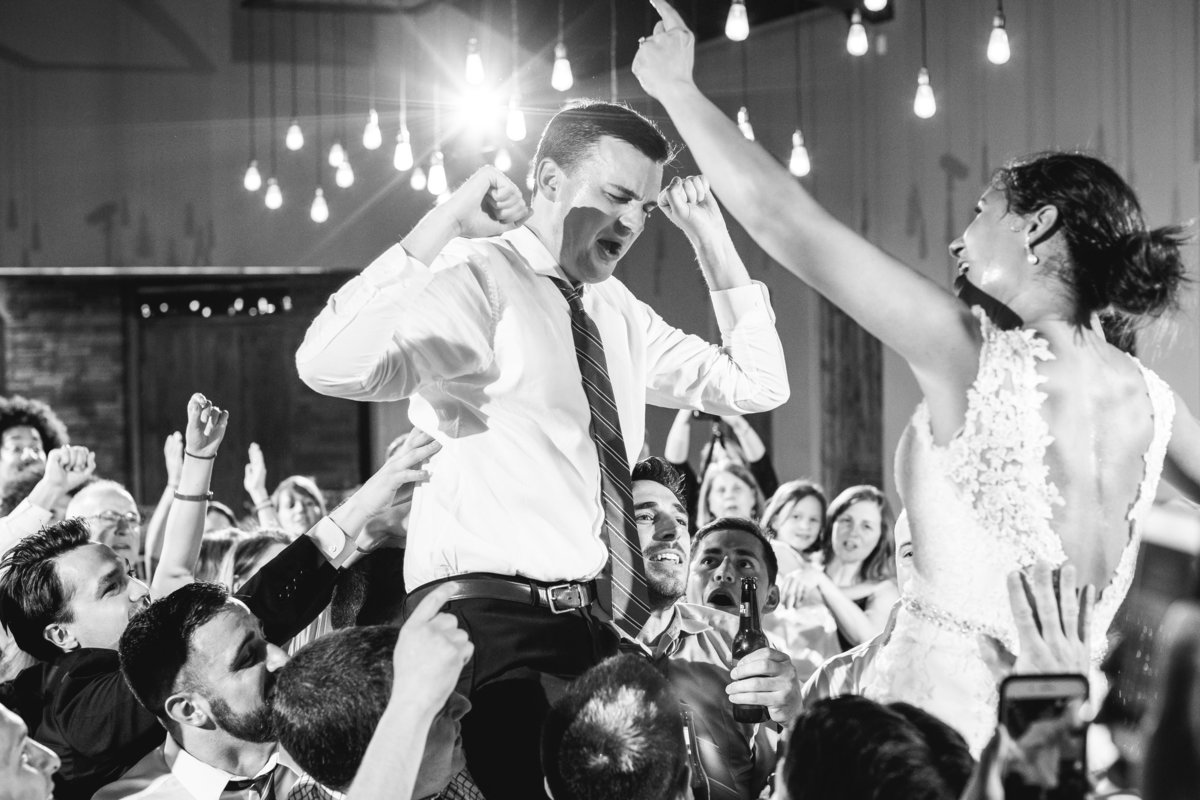 canyonwood ridge wedding photographer bride groom on shoulders reception live band 250 S Canyonwood Dr, Dripping Springs, TX 78620