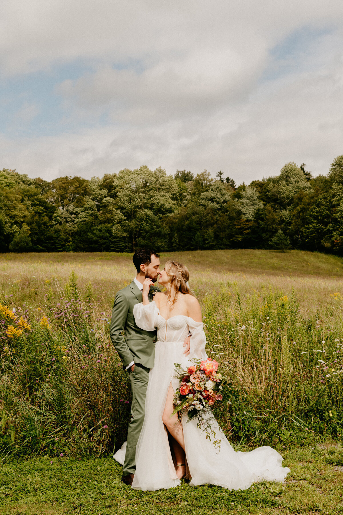 new york wedding couple in a field