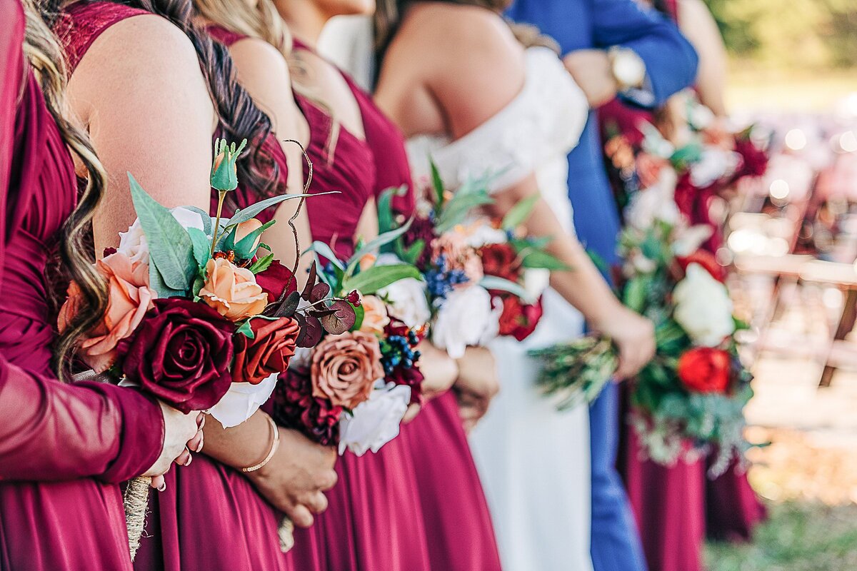 bridesmaids lined up with bouquets at Bending Branch Ranch