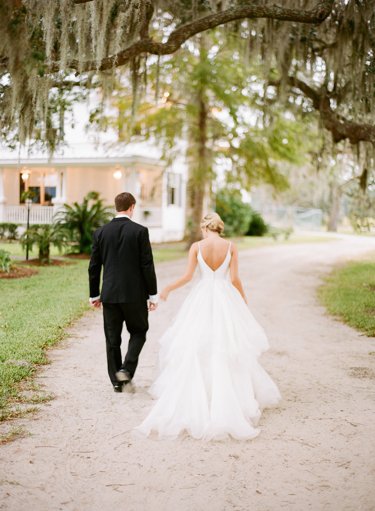 Bride and Groom Newlyweds Walking after Charleston Wedding Ceremony