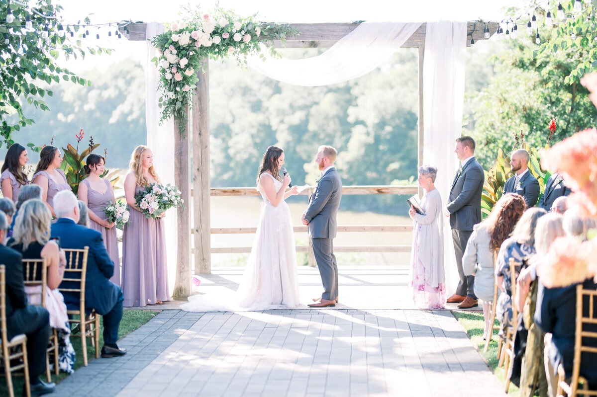 Bride and groom exchange vows at their beautiful outdoor Toronto wedding