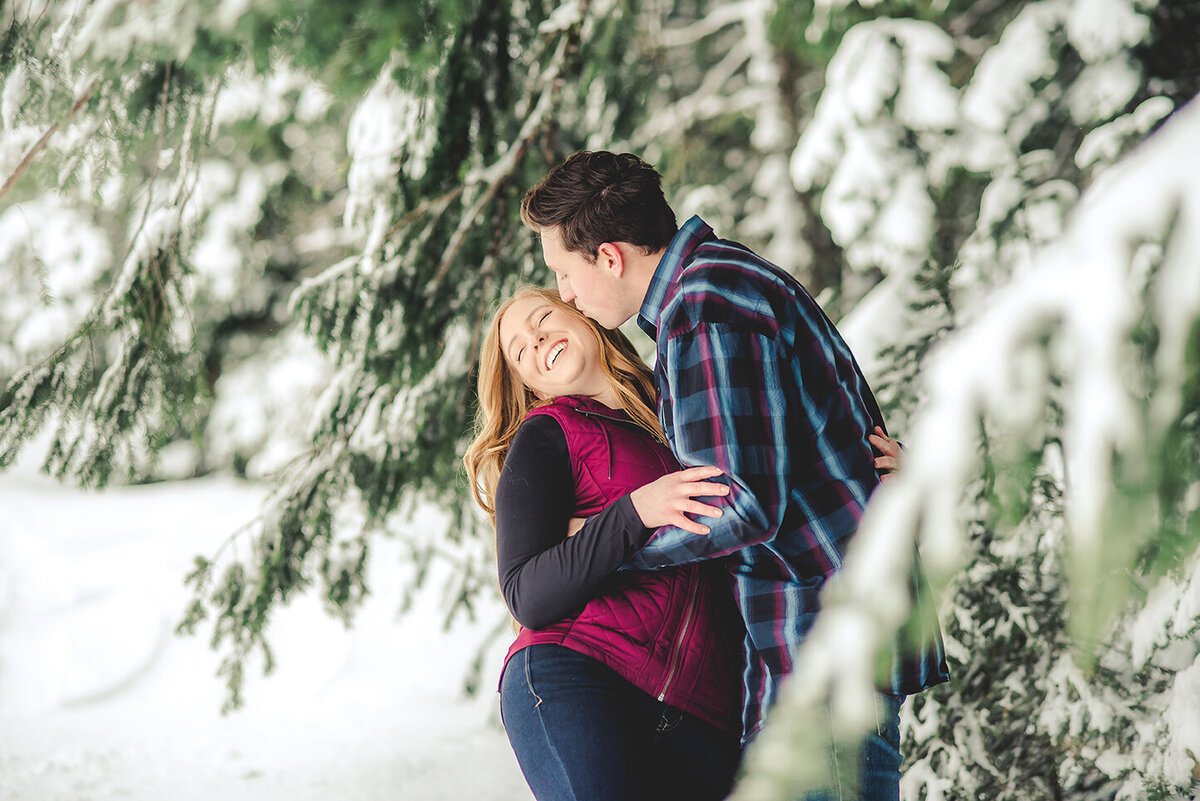 couple laughing in snow
