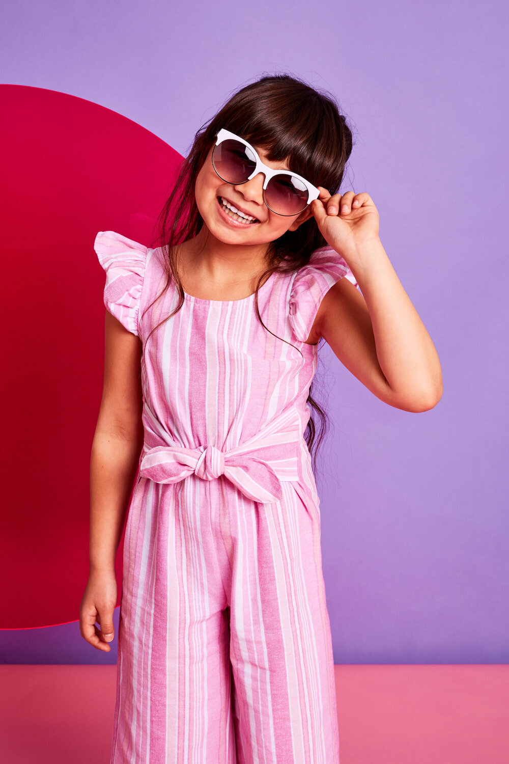 Greer Rivera Photography Kids Editorial Photoshoots Marin CA Girl with Sunglasses in front of pink and purple background