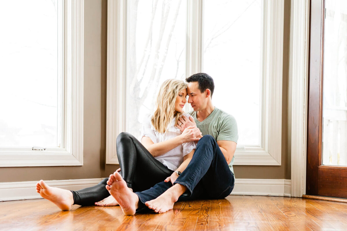 Man and woman barefoot at an in home couples photography session near Chicago, IL.