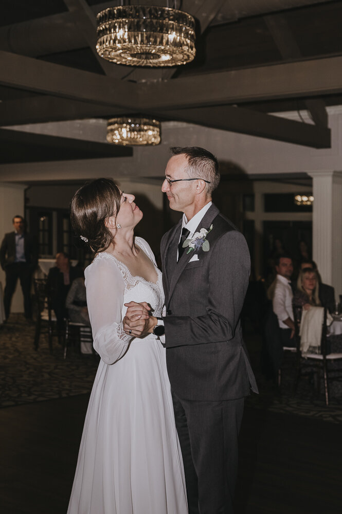 the bride and groom dancing together