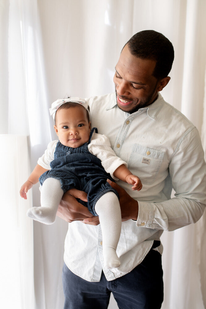 Family session of little girl and her father