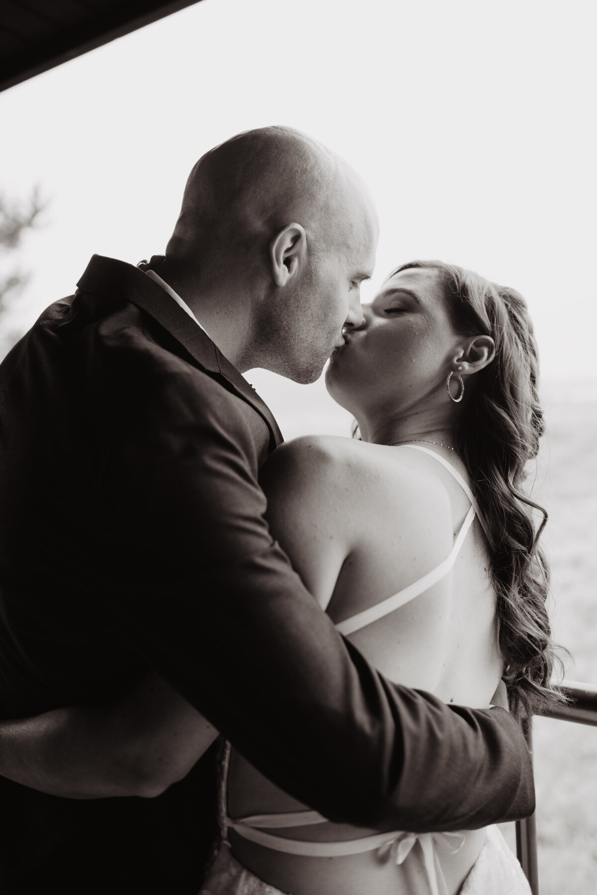 Jackson Hole photographers capture bride and groom kissing before adventure elopement