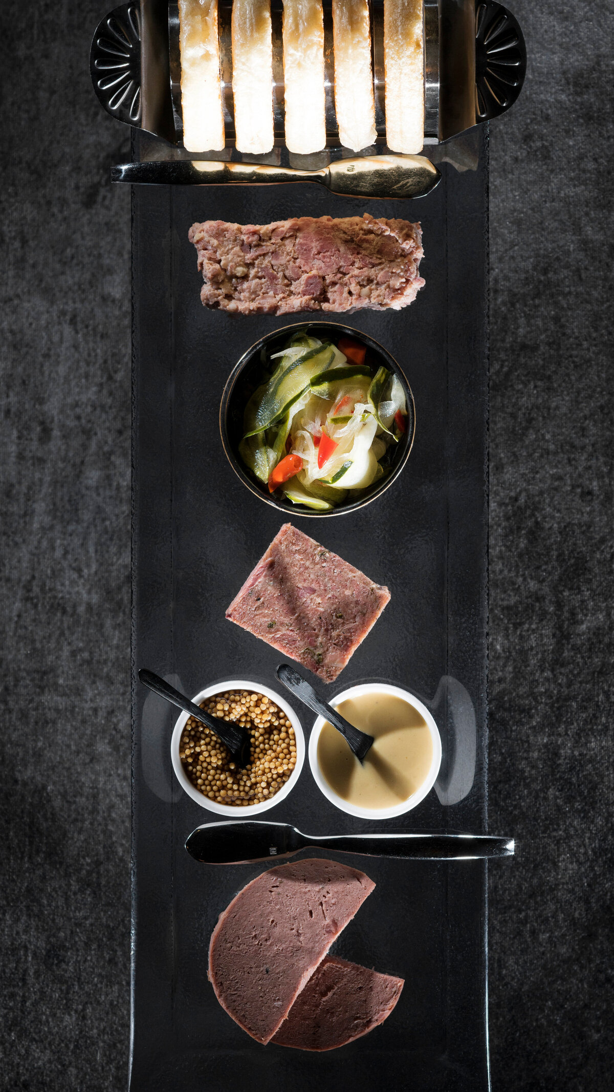 Meat and veggies laid out on a board