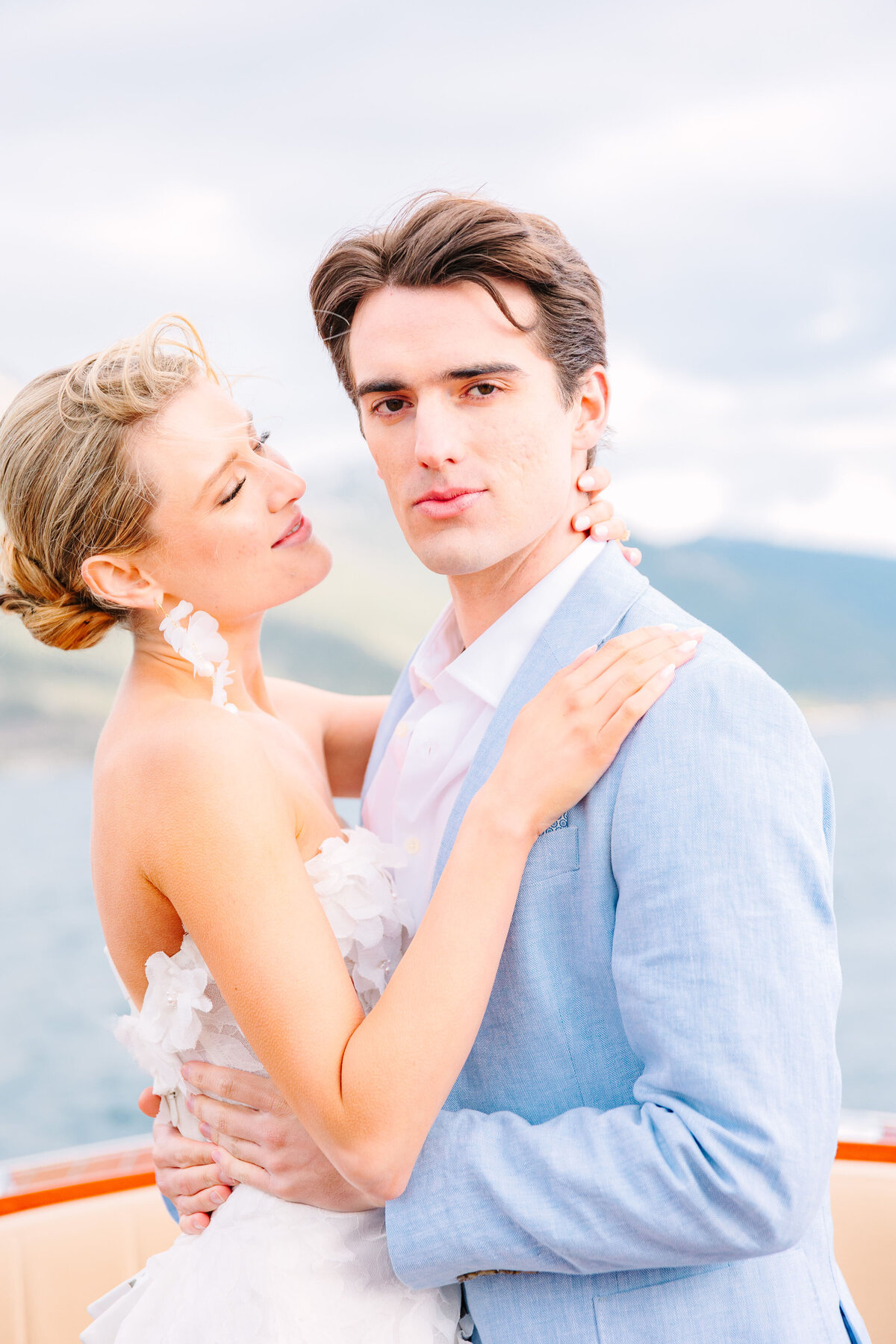 Bride and groom hold hands while walking up Lake Tahoe mountainside for elopement