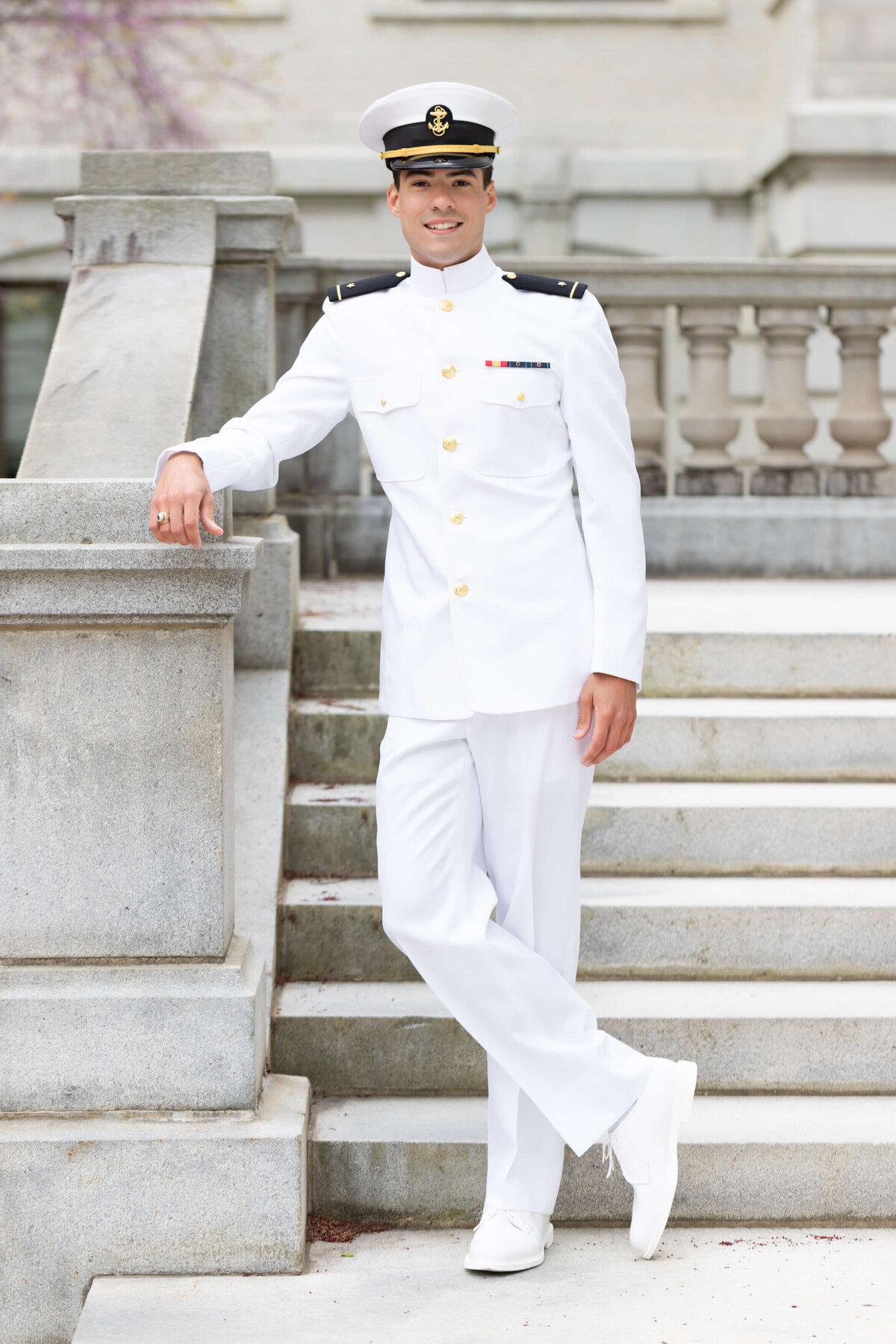 Senior Photo of Sailor in Whites outside Mahan Hall at the Naval Academy in Annapolis, Md.