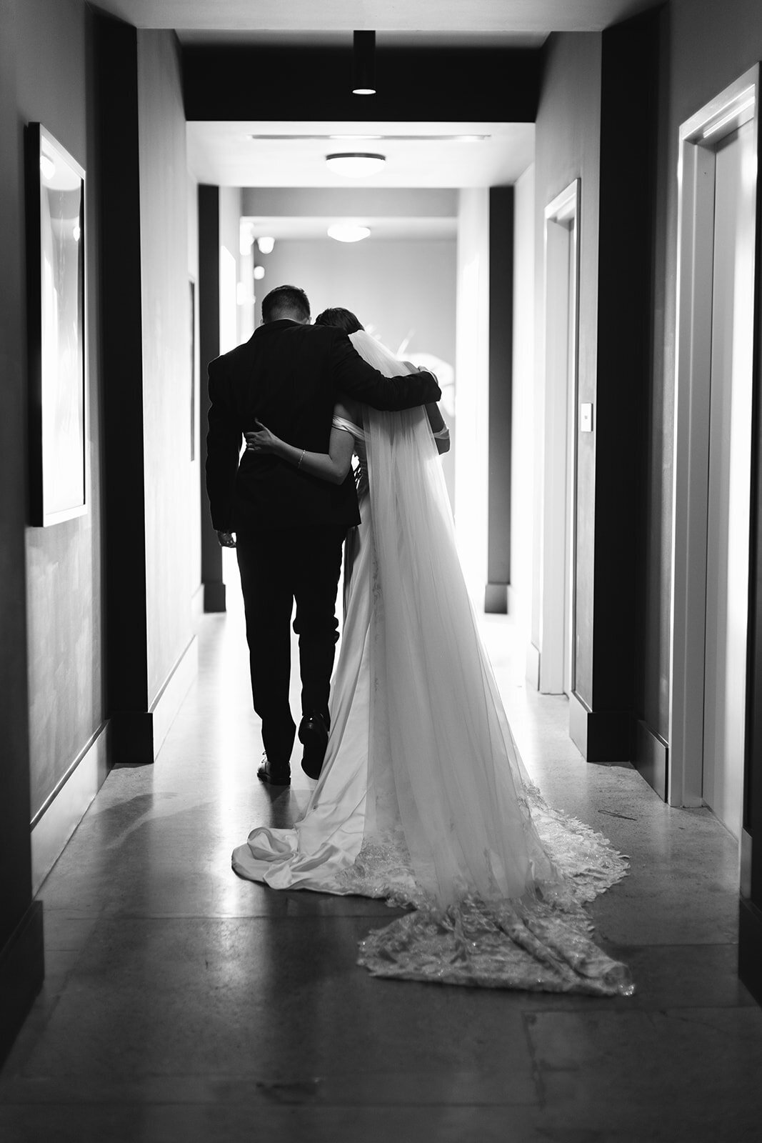 bride-and-groom-walking-down-hallway