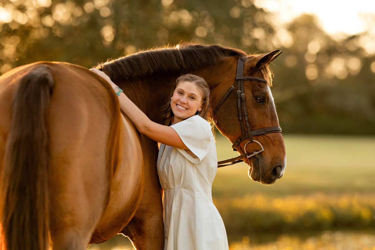 Senior photo ideas with horses taken in Fairhope, AL by professional senior photographer.