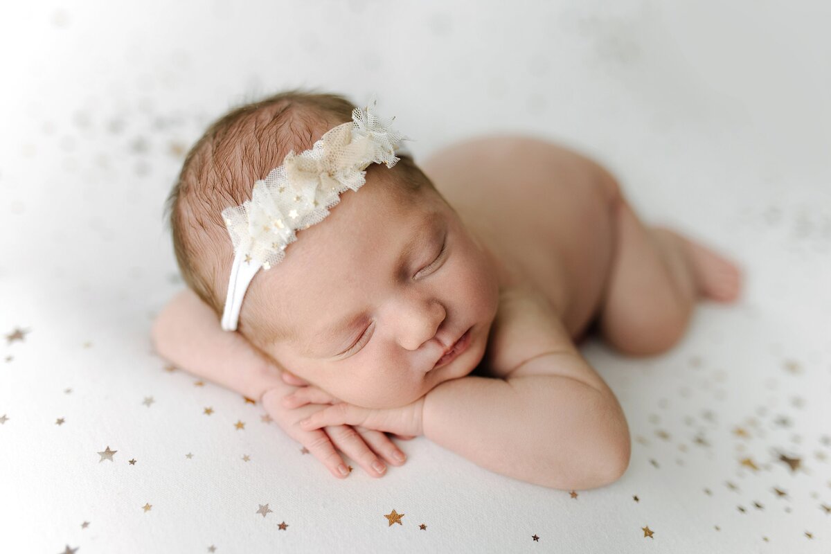 Newborn baby girl on a star blanket Trussville Alabama newborn photographer