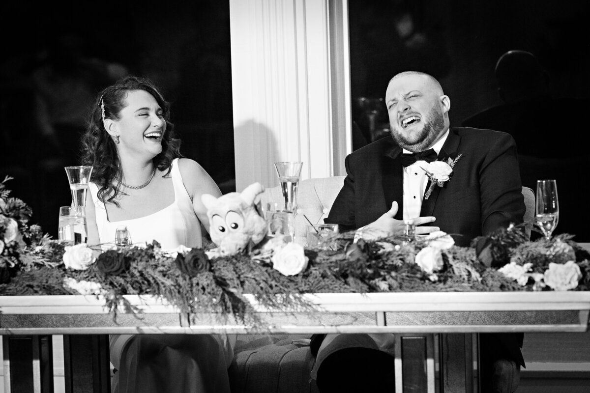 birde-groom-candid-laughing-toasts-black-and-white-nj