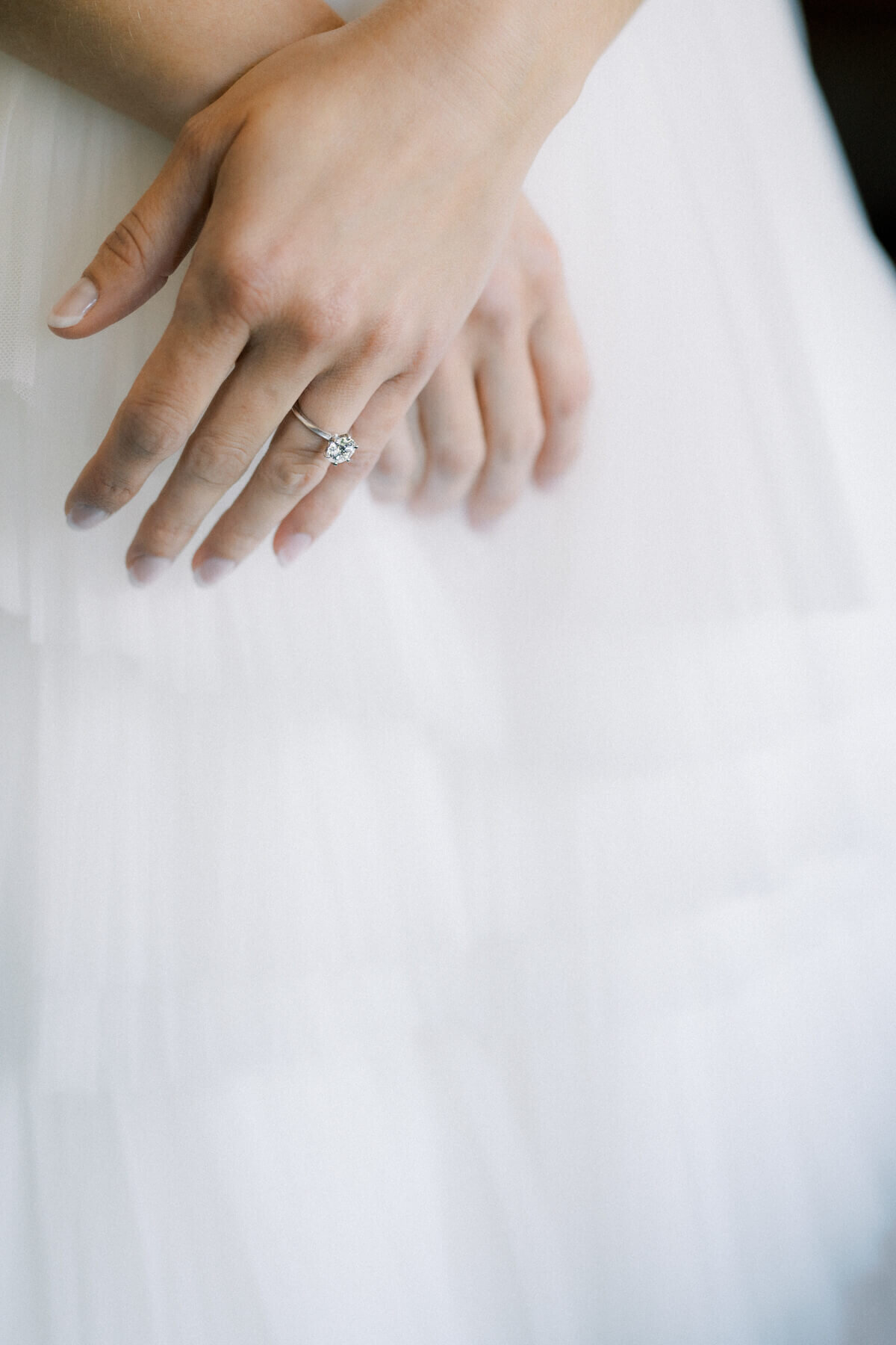 Bride's hands with her engagement ring