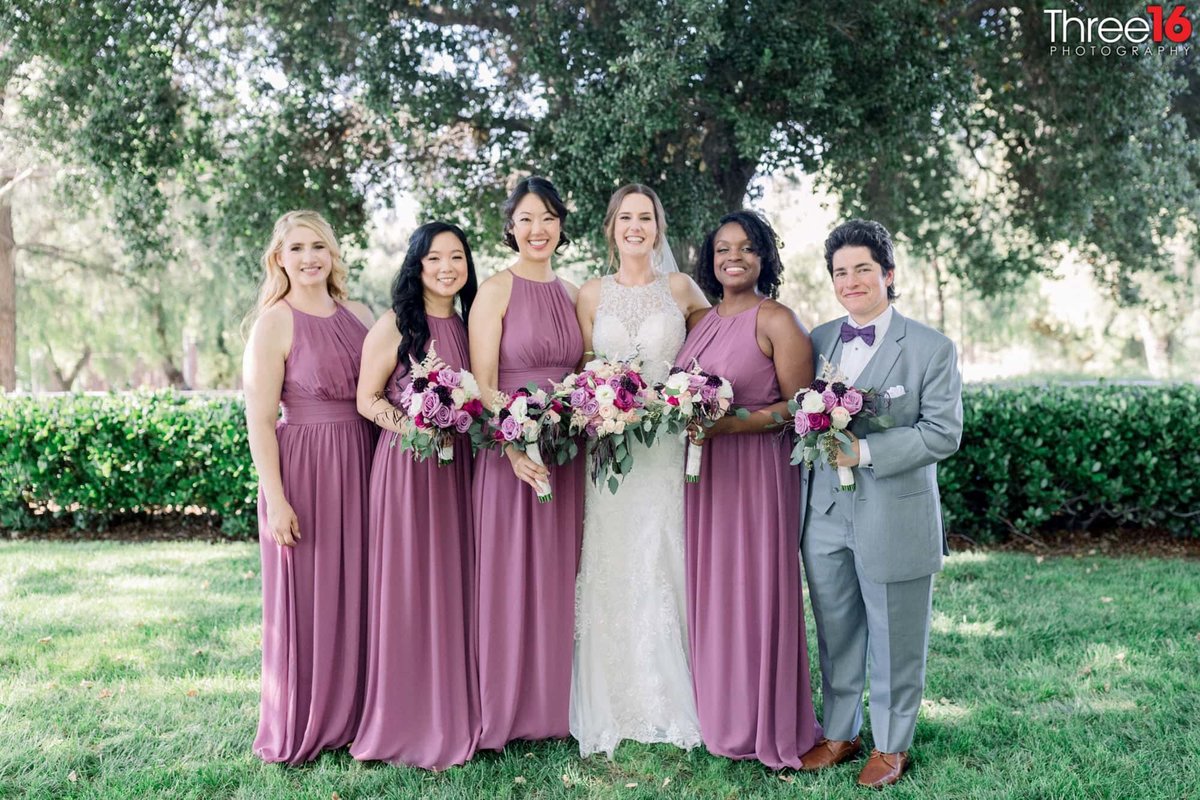 Bride poses with her wedding party
