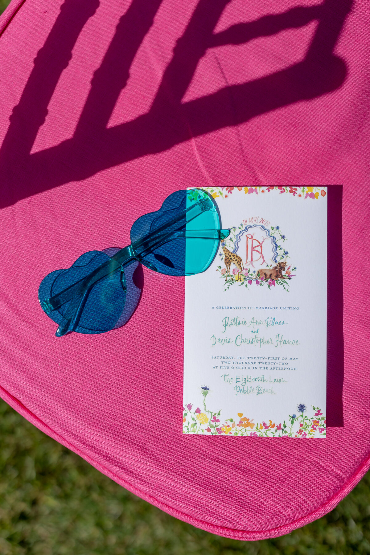 Colorful sunglasses and program at a Pebble Beach wedding