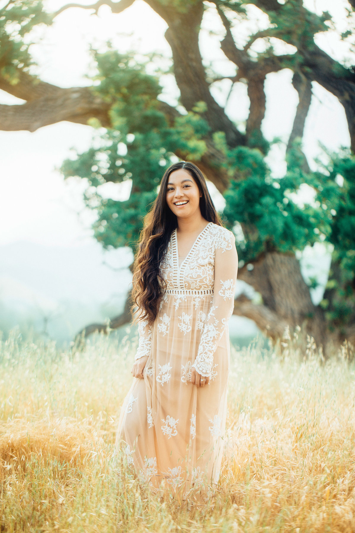 Engagement Photograph Of  Woman In Orange Dress Smiling Los Angeles