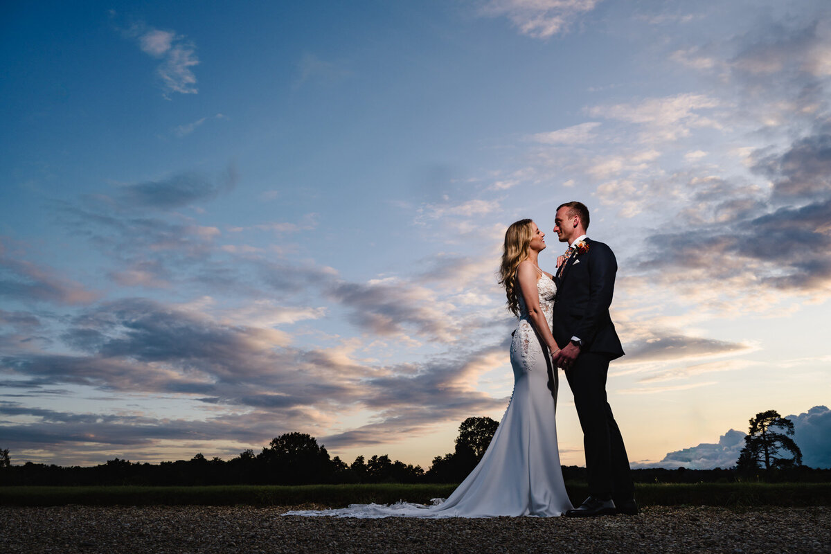 Nightime sunset photo of bride and groom at gosfield hall
